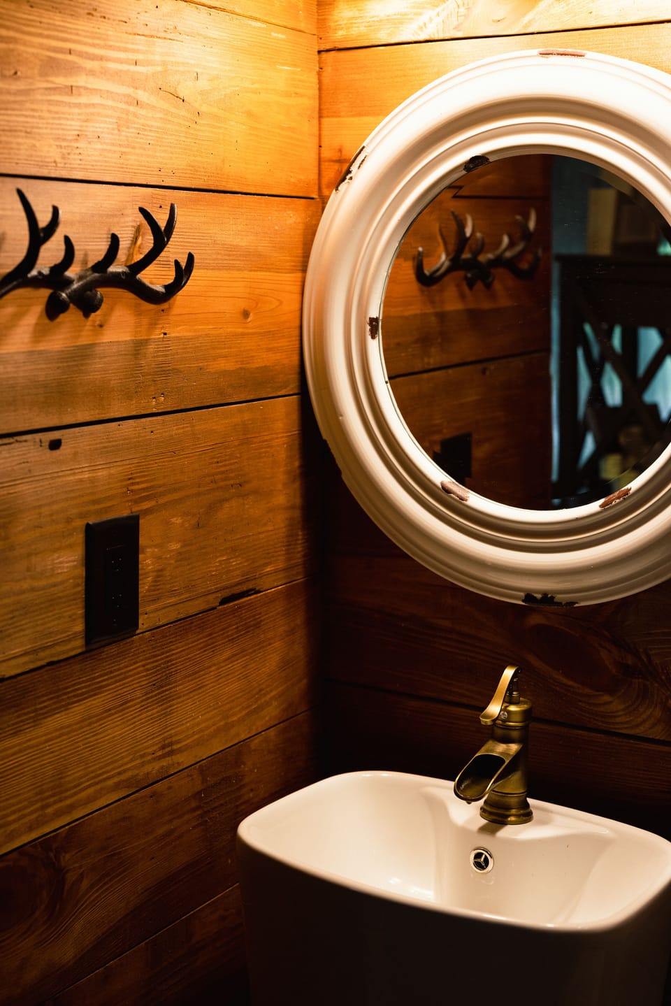 A full bathroom suite includes a tiled walk in shower, pedestal sink & commode. 