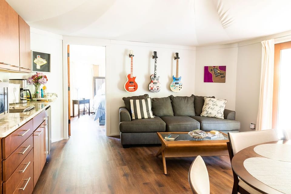 The Music Loft Glamp living room features a memory foam queen sleeper sofa.
