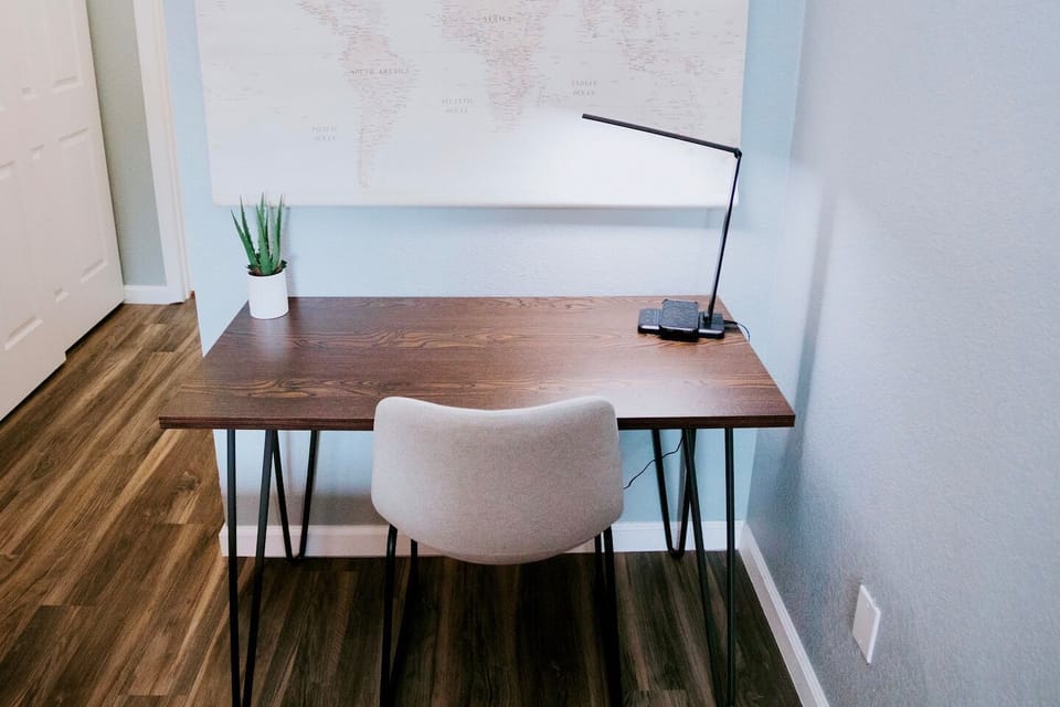 Dedicated workspace with QI charging lamp, USB port, and lightening fast wifi.