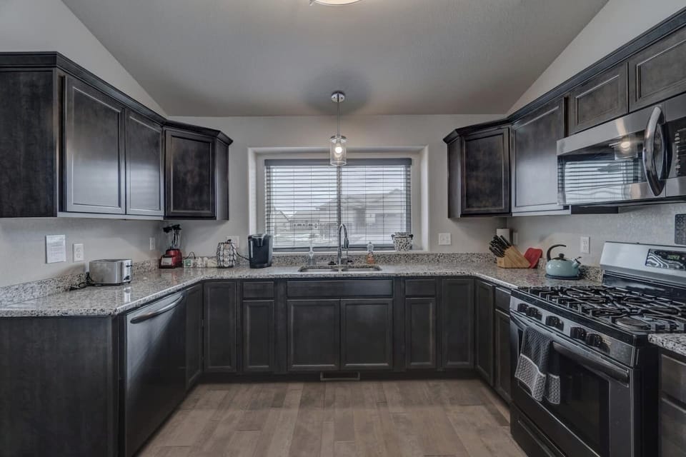 Spacious kitchen with all the necessities for eating in while traveling. 
