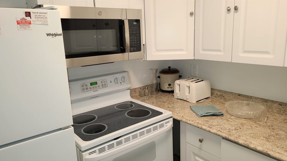 New microwave. Electric stove. Frig, toaster, blender pots pans dishes.