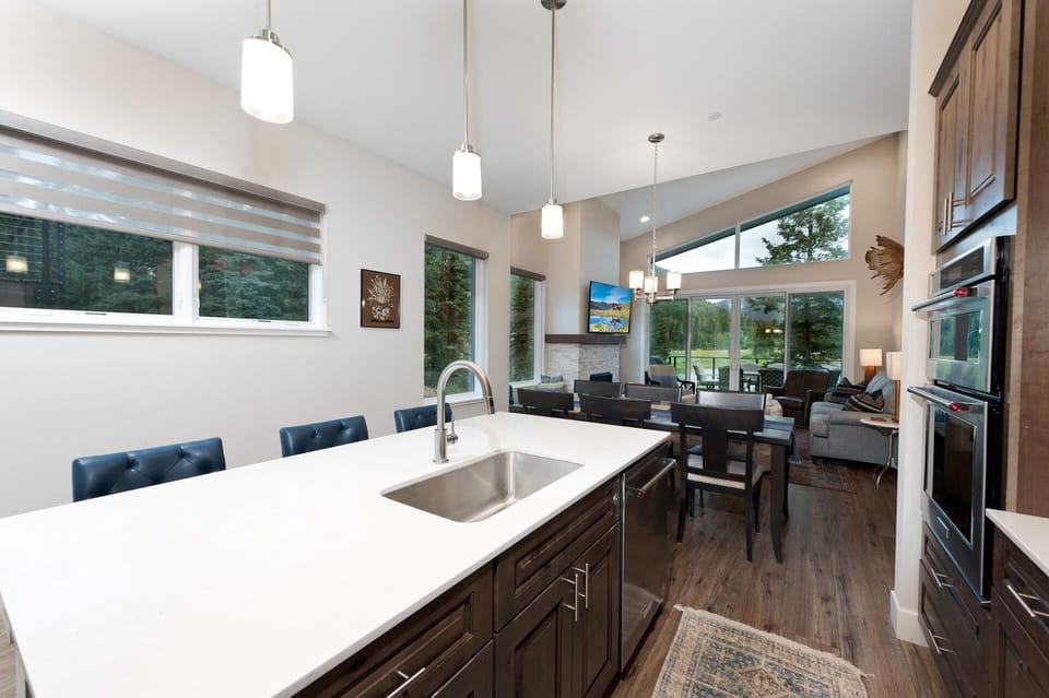 Fully Stocked Kitchen looking into the Dining and Main Living Spaces