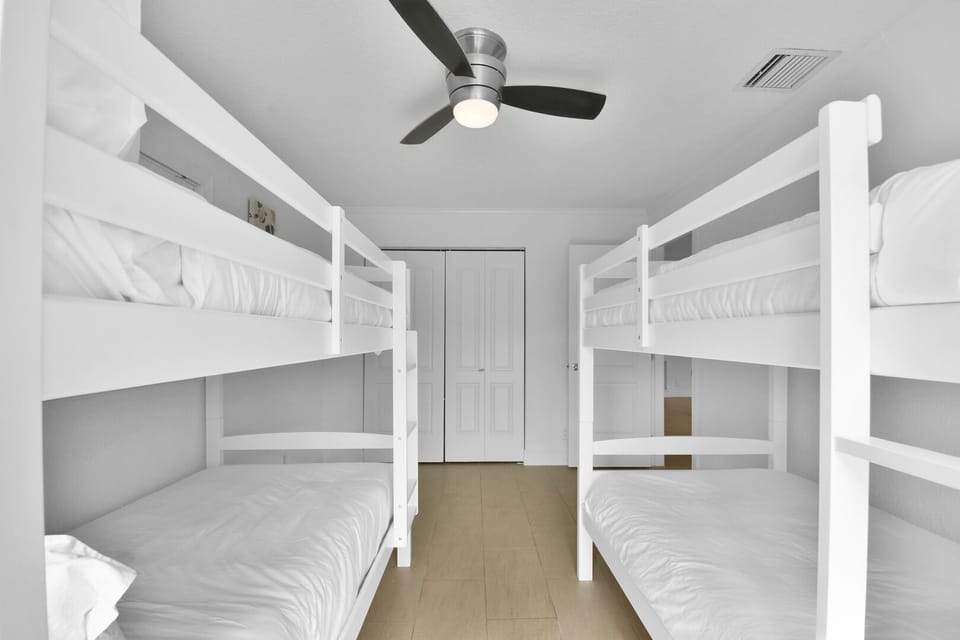 Bedroom 3 
2 bunk beds providing 4 twin beds
Ceiling Fan
Storage
Patio doors to pool area