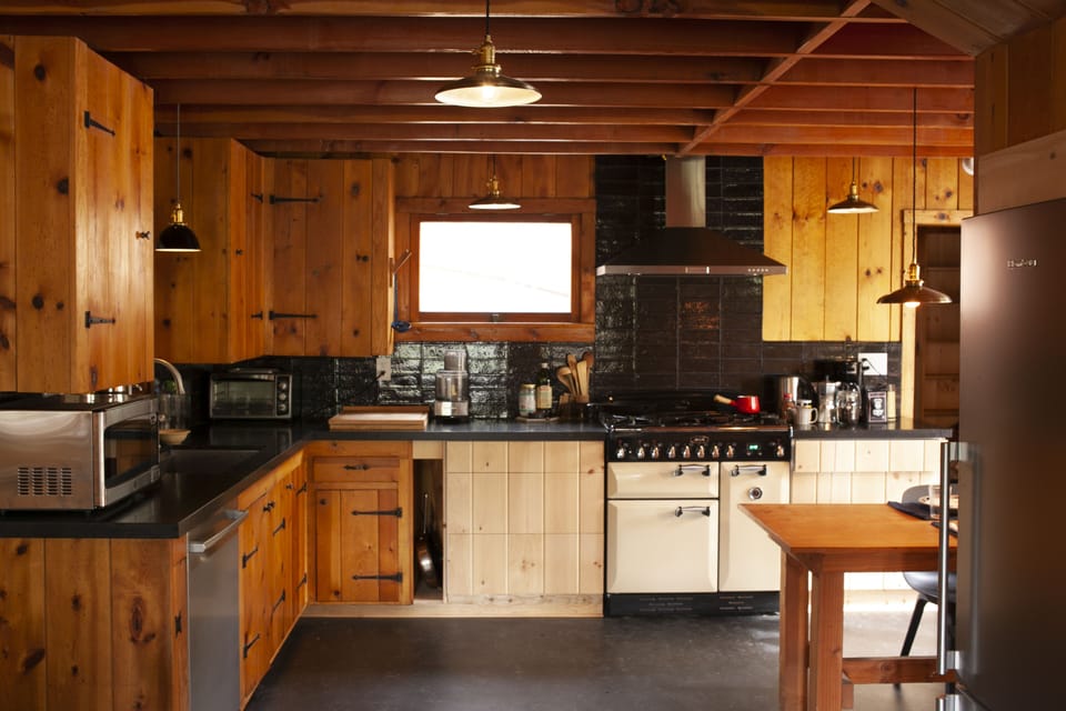 Kitchen well equipped with microwave, toaster oven, AGA professional gas range 
