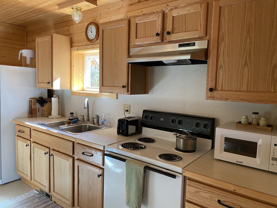 Fully stocked kitchen for cooking, baking, grilling, eating.