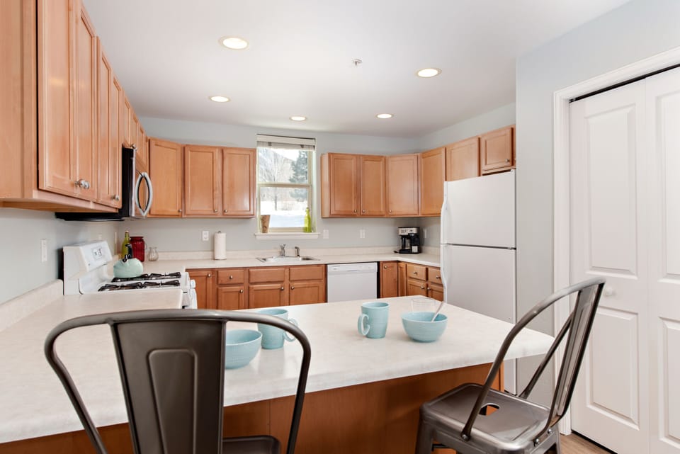 View from breakfast bar seating into kitchen 
