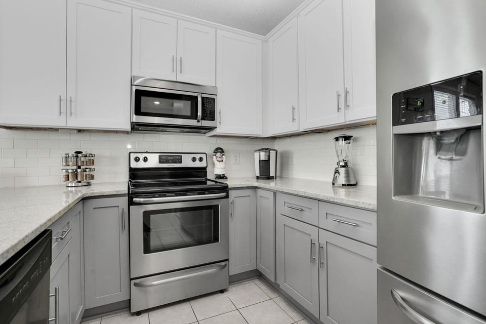 Your modern kitchen features stainless steel appliances and ample counter space for preparing memorable vacation meals together.