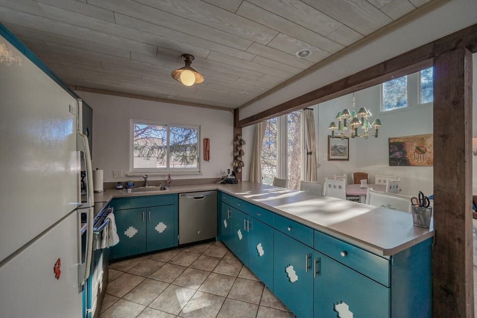 Fully-appointed kitchen with bar seating.