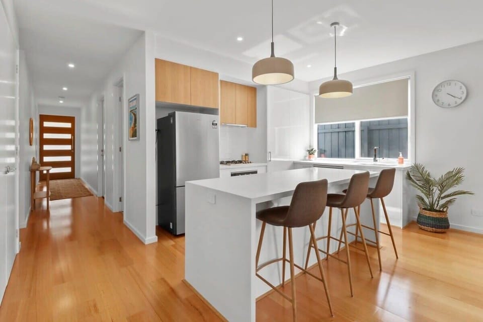 Looking too front door from open plan living room