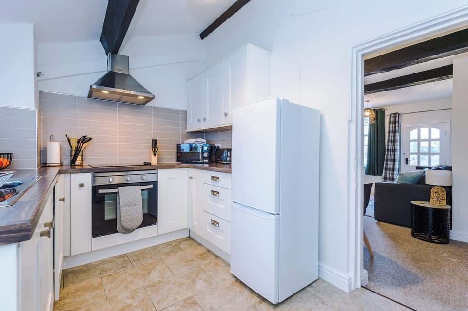 The fully equipped kitchen is perfect for cooking an array of meals during your stay.