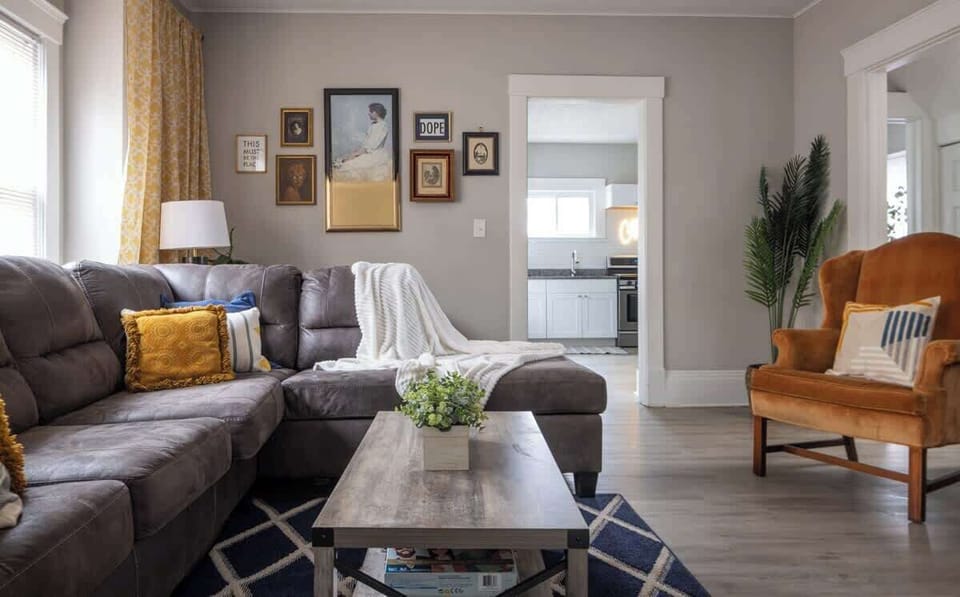 Inviting living area w/ sofa, coffee table & warm, homey decor