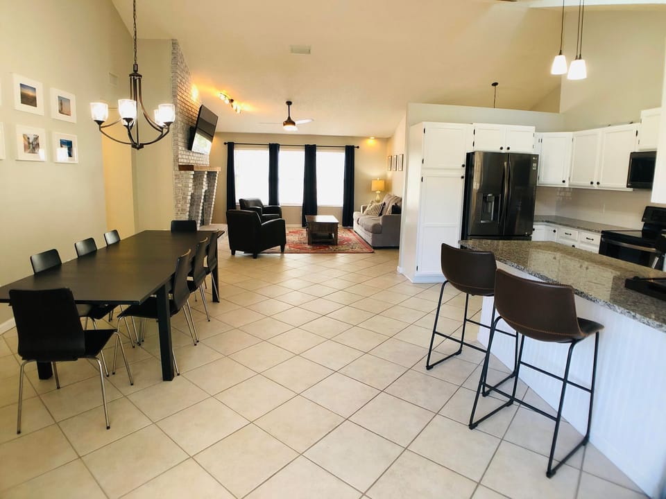 Open-Concept Living, Dining & Kitchen • Bright Spacious Gathering Area