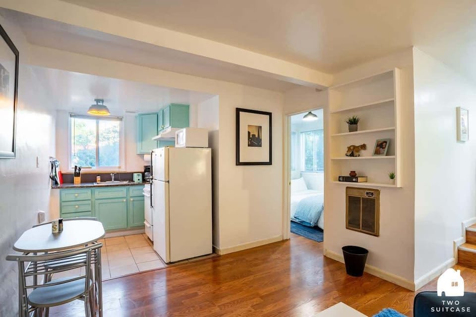 Simple and cozy dining space with plenty of light, great for meals or catching up over coffee.