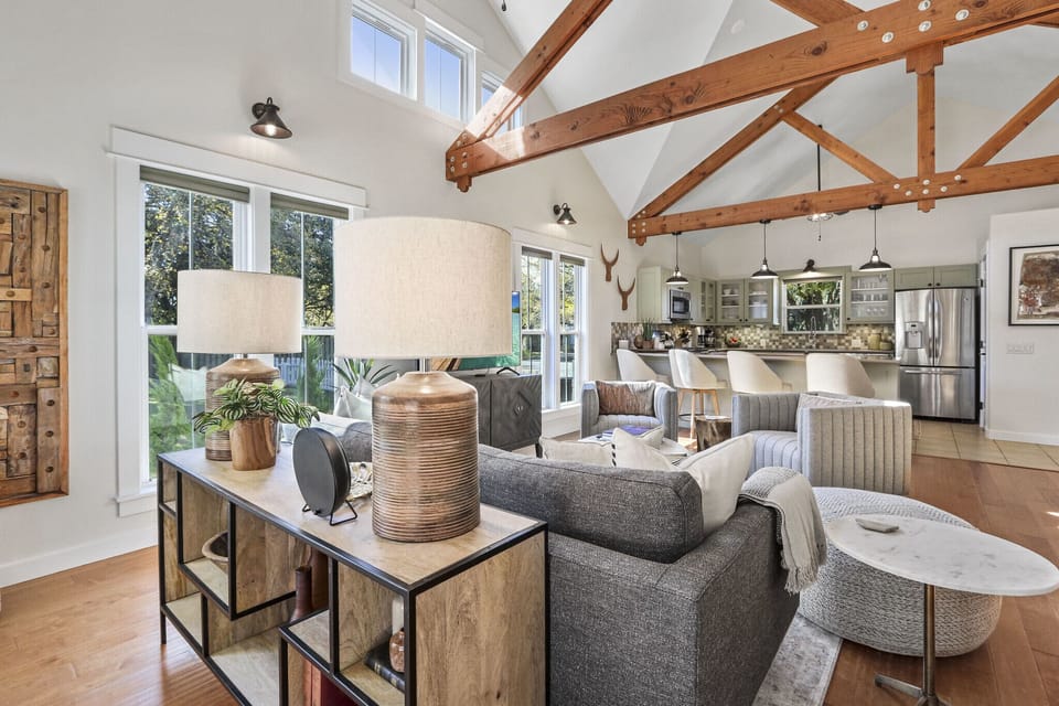 The kitchen with bar seating is just off the living room.