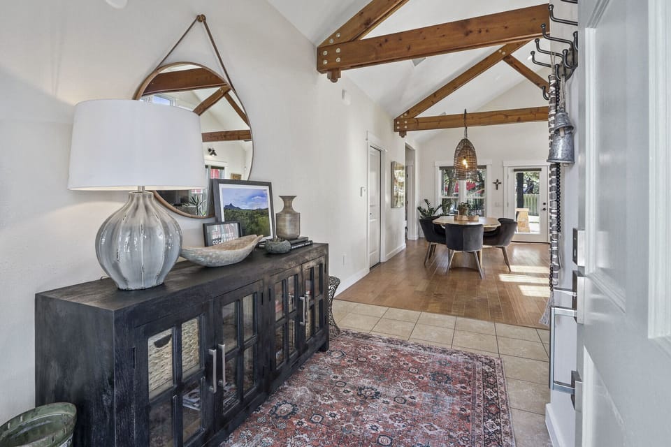 Closer view of side table with dining table in foreground.