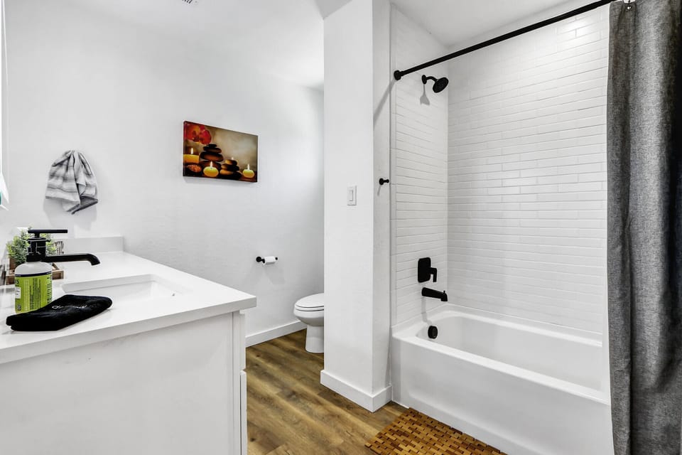 There is a shower tub combo in the bathroom