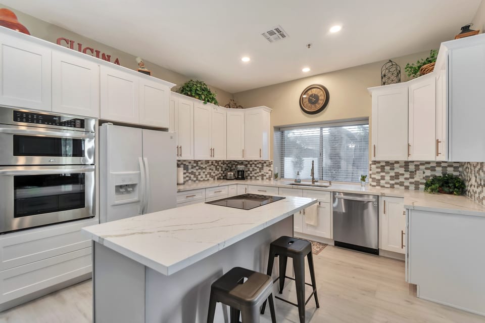 Large Kitchen with Island and very well stocked.