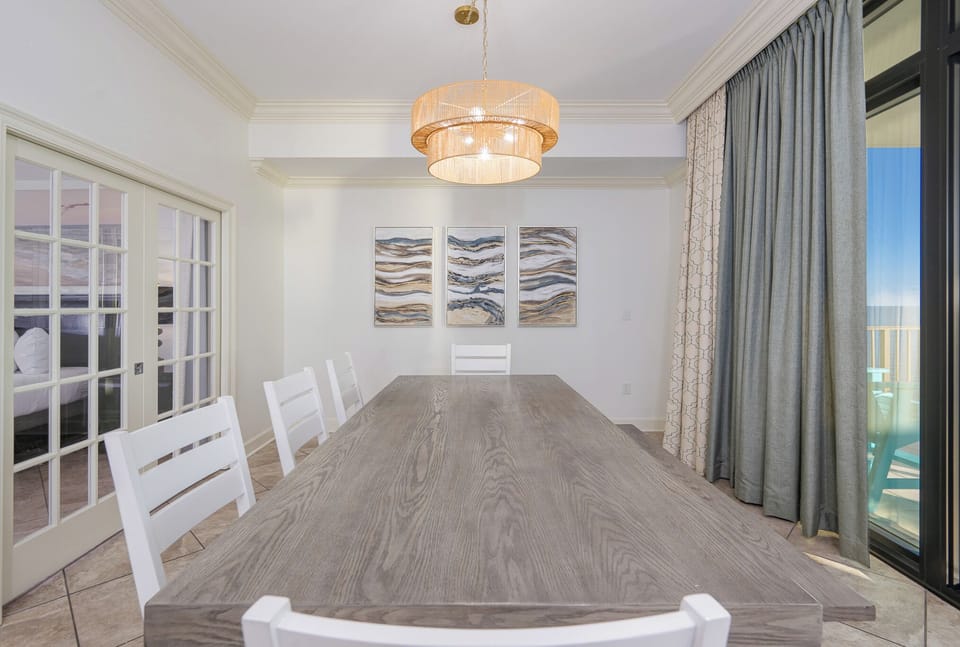 Gather around the spacious dining table, sharing laughter and stories while enjoying the coastal view