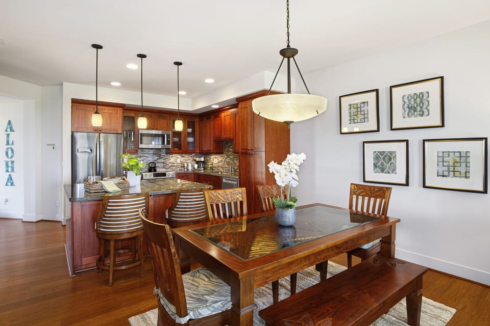 Open-concept dining area flows seamlessly into the kitchen, making mealtimes and conversation effortless for the whole group.