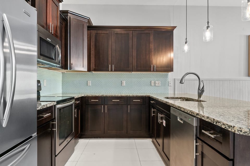 Kitchen stocked with coffee maker, toaster oven, and cooking essentials