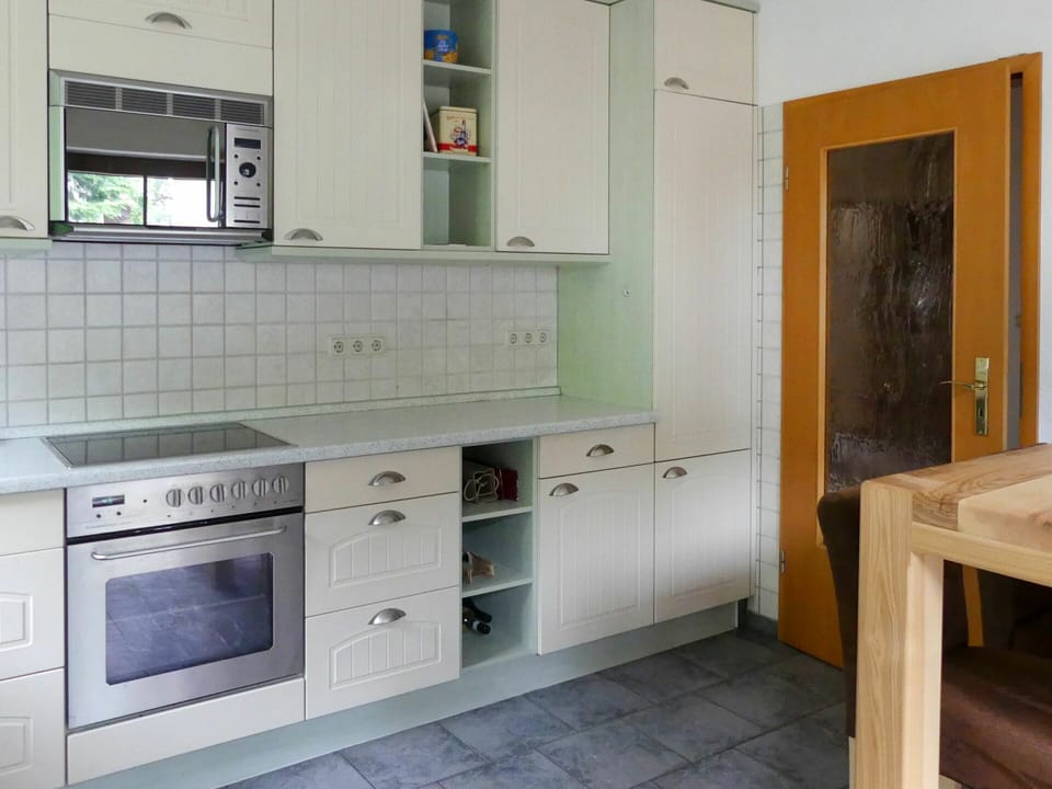 Cabinetry, Furniture, Building, Countertop, Kitchen Stove, Kitchen, Interior Design, Flooring, Kitchen Appliance, Wood