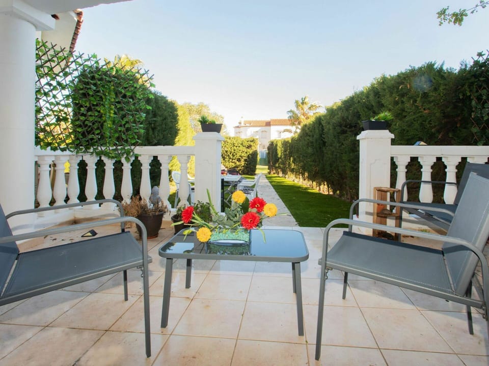 Flower, Sky, Furniture, Property, Plant, Couch, Building, Flowerpot, Outdoor Furniture, Shade