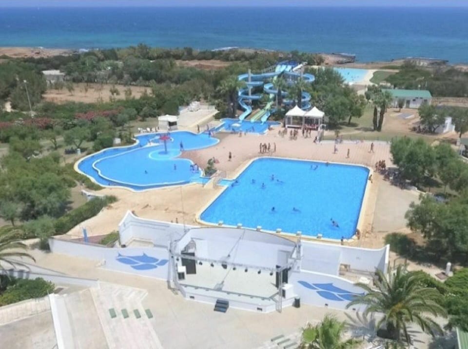 Water, Property, Swimming Pool, Azure, Seaside Resort, Tree, Body Of Water, Leisure, Urban Design, Landscape