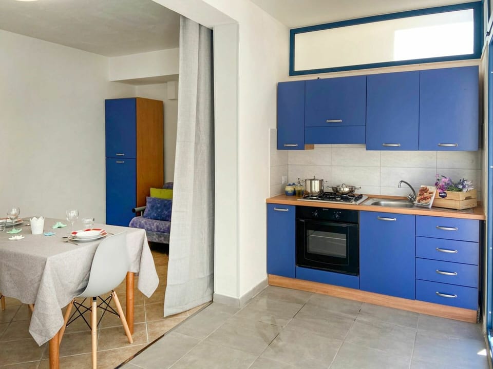 Countertop, Cabinetry, Furniture, Property, Blue, Building, Azure, Kitchen Sink, Kitchen Stove, Wood