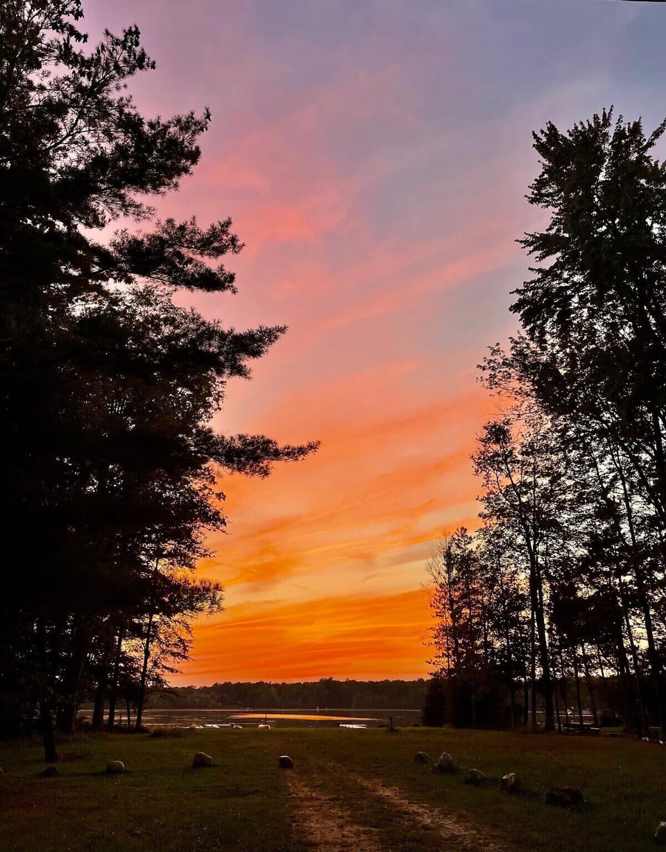 Spectacular sunset above Upper Scott Lake where your private beach area with dock awaits...