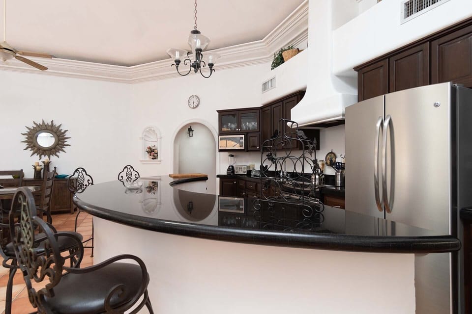 the wrap around counter is in stunning black granite