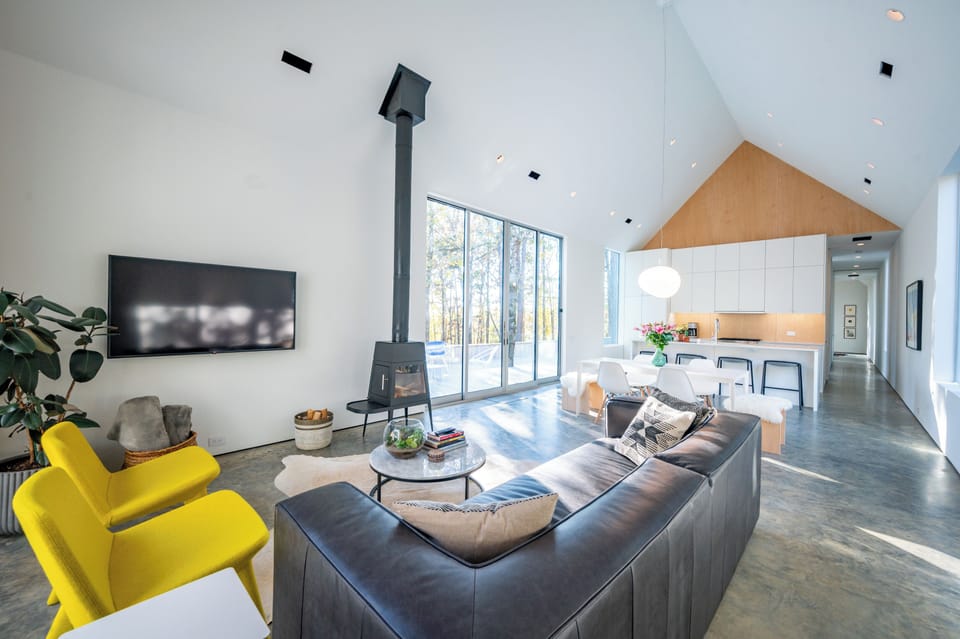 Living Room: Modern elegance meets nature with stunning views and vibrant decor!