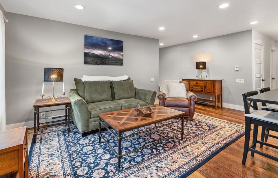 Living area and view towards entrance ( left ) and main hallway ( right )