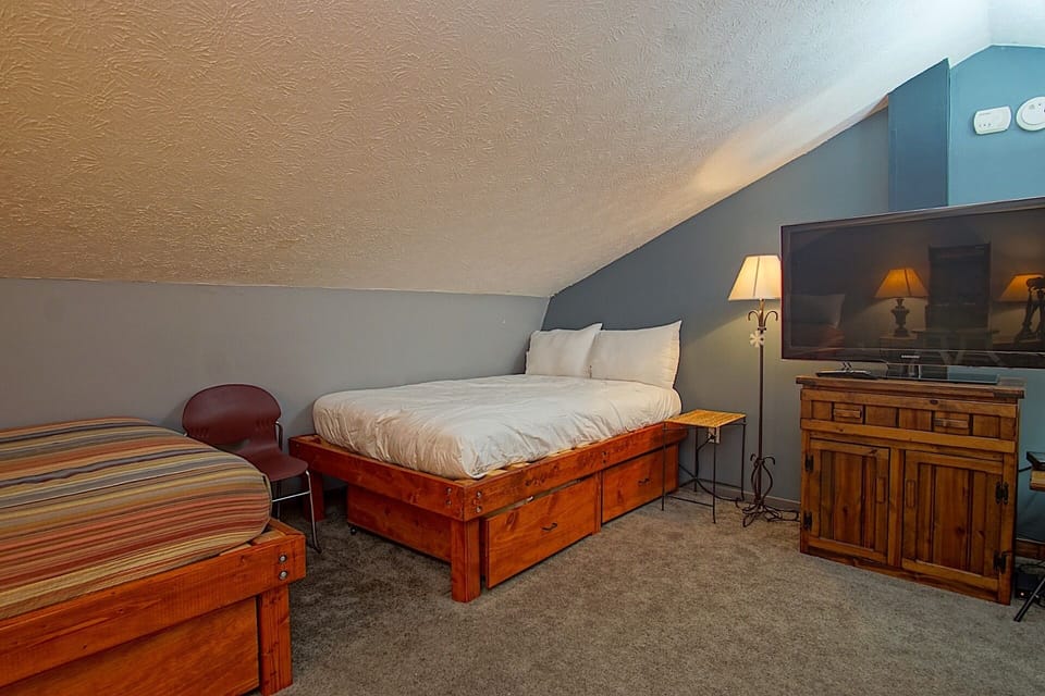 The loft has two full sized beds and a queen