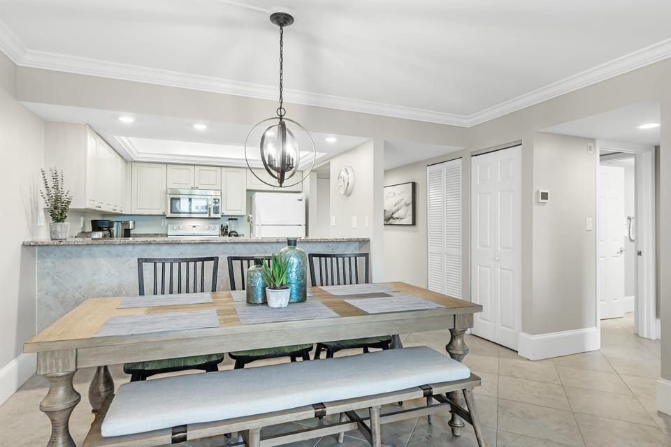 Dining area with view into kitchen.  Plentry of room to gather around the table
