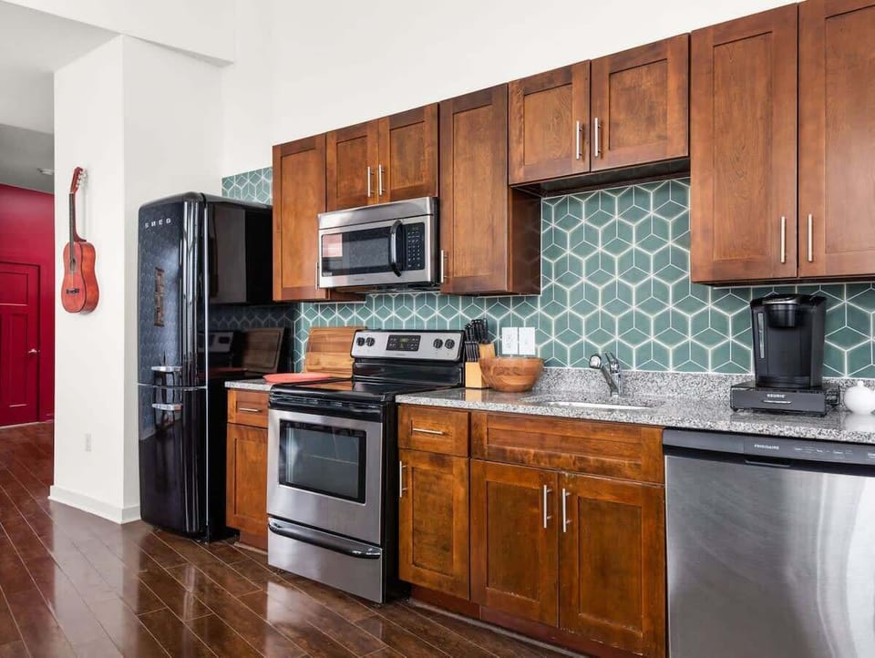 Fully equipped gallery kitchen w/ Smeg fridge, 4 burner stove, oven, Keurig coffee maker. We provide fresh, locally ground coffee, tea, and cooking essentials (sugar, salt, pepper, olive oil and vinegar)