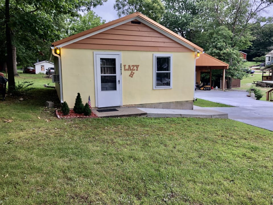 Cozy cabin with plenty of parking, outside electrical outlets accessible.