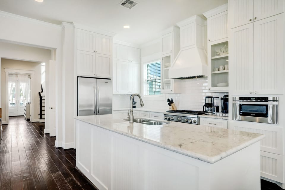Fully stocked kitchen that opens to the dining room and living room