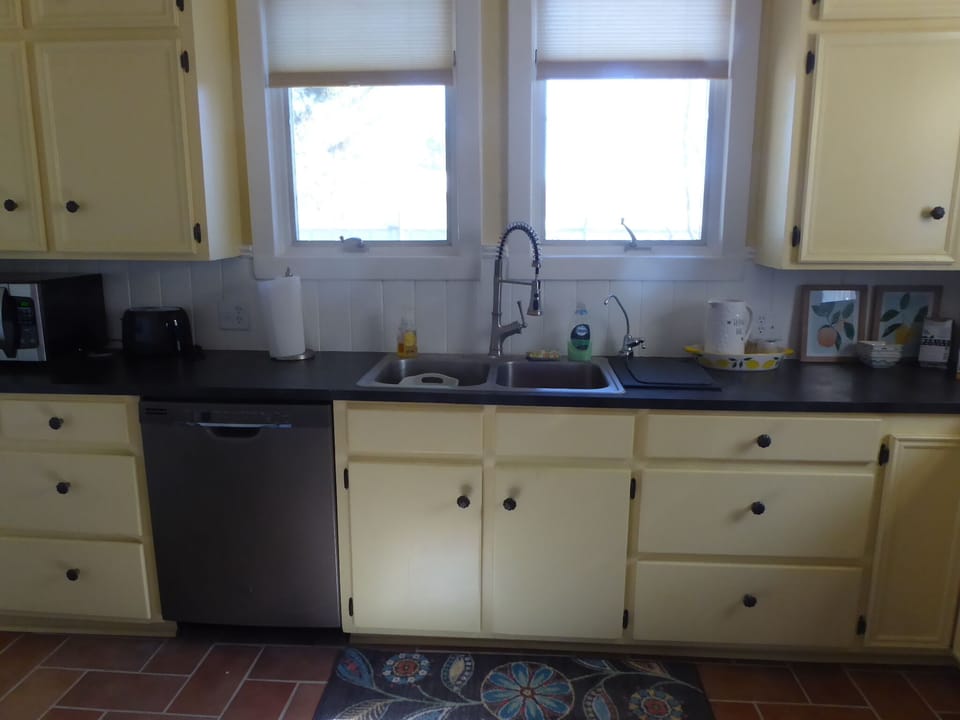 Country kitchen with modern appliances.