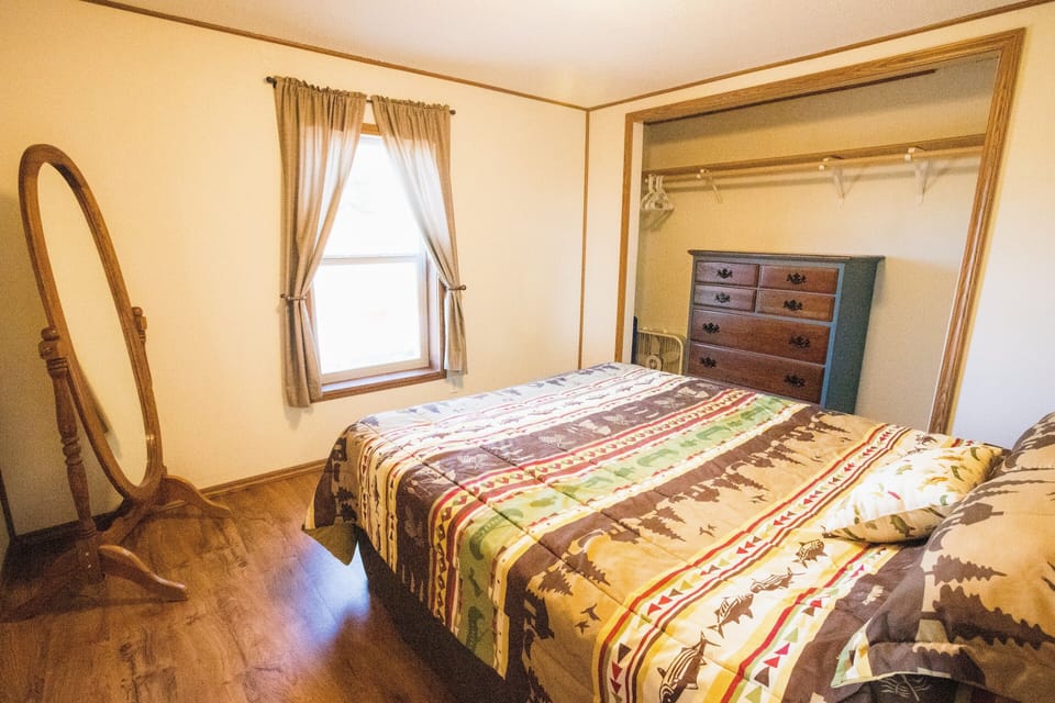 Far "master" bedroom with queen Purple mattress.