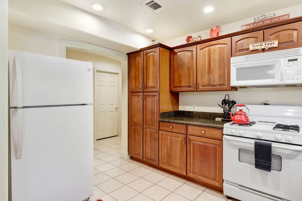 Spacious kitchen with modern appliances, generous counters, and open layout, perfect for cooking, entertaining, and memorable guest experiences.