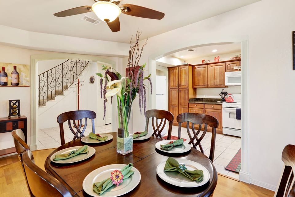 Spacious dining area with seating for six, inviting guests to gather for meals, conversations, and memorable experiences.