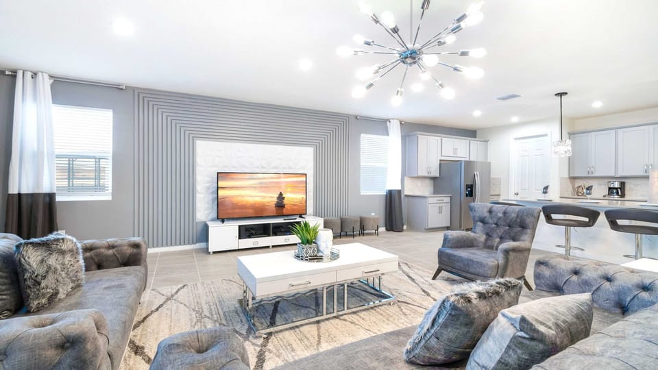 Modern open-concept living room with stylish decor & cozy vibes!