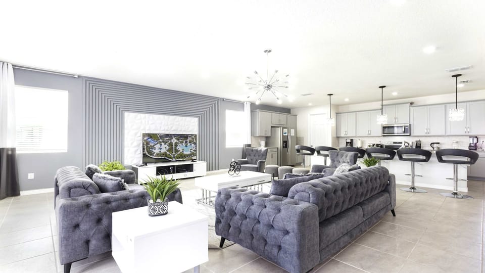 Spacious modern living area with sleek kitchen and chic decor!