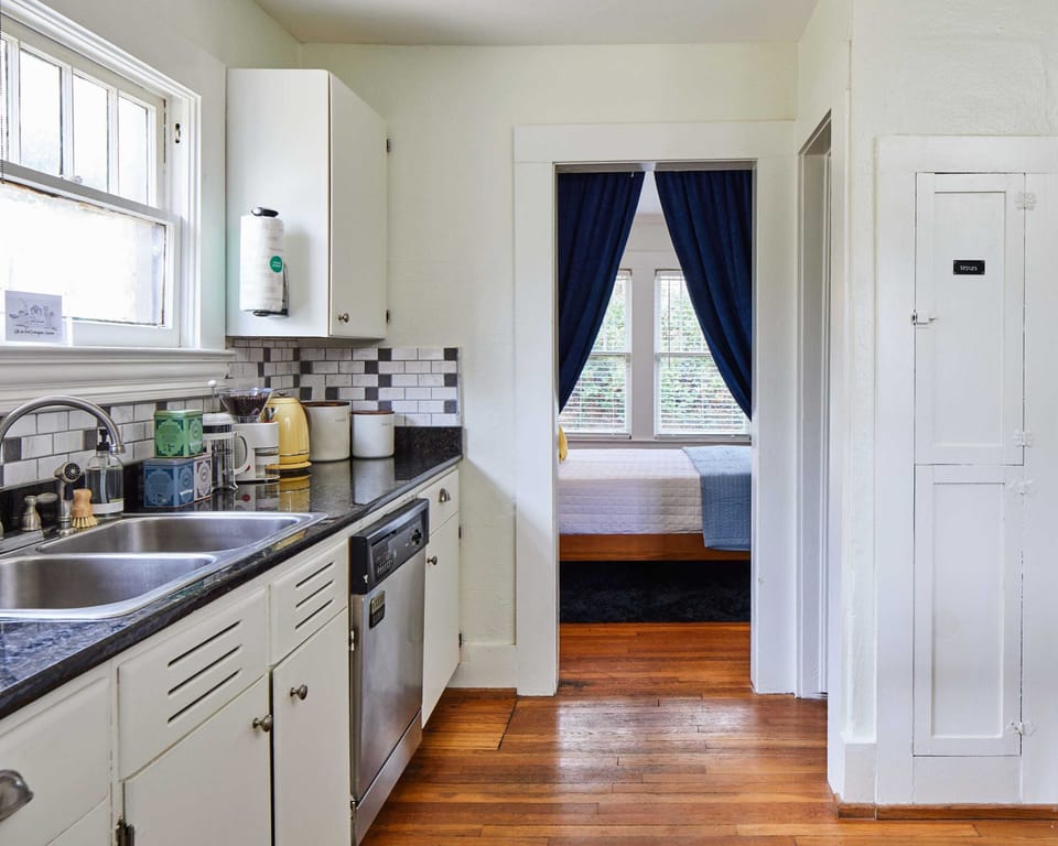 Easily access the kitchen from the second bedroom.