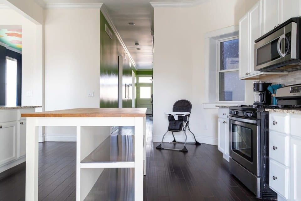 Polished floors and stainless steal appliances in this beautiful kitchen. #StyleTravel
