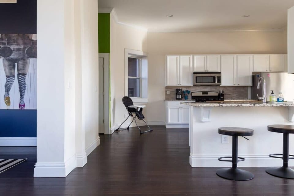 A clean and functional kitchen space featuring a large central island that makes hosting and meal prep a breeze. #TravelEats 