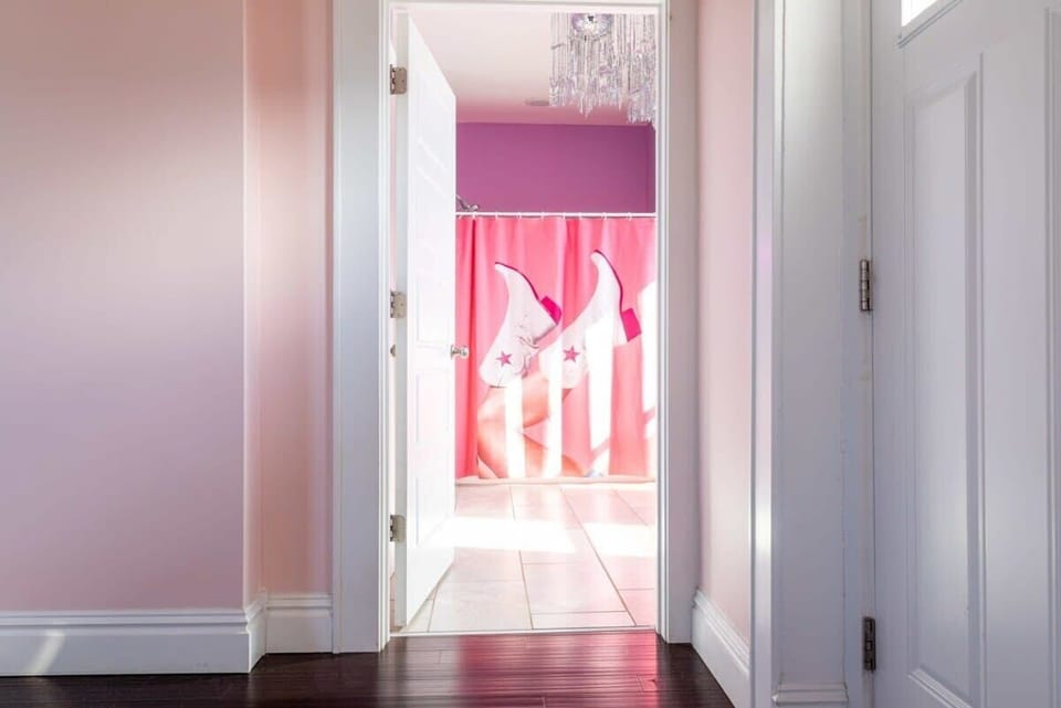 Step into a world of playful design in this vibrant bathroom. #BathroomDesign 