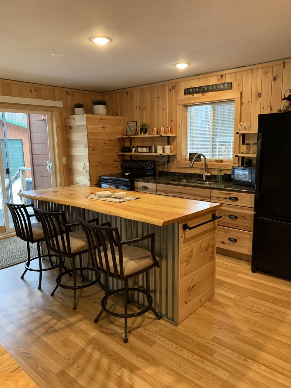 Kitchen with island storage. Grill on the deck so all set to cook if you’d like.