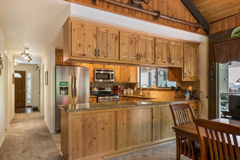 Fully stocked kitchen with a stove, dishwasher, microwave, oven and refrigerator