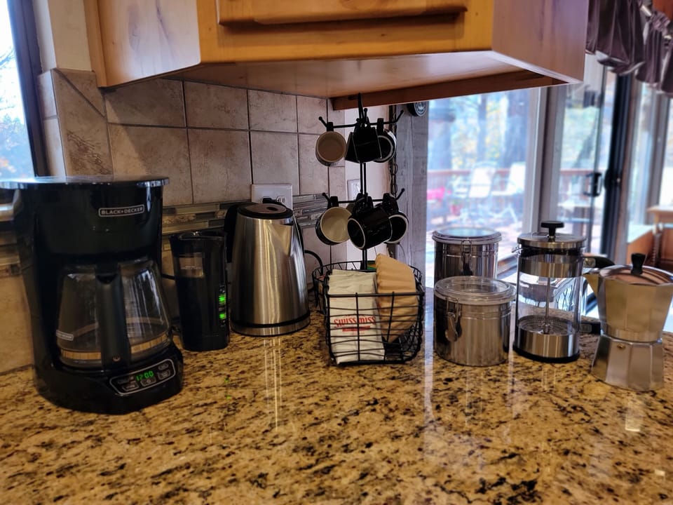 Coffee bar with French press, moka pot, drip coffee. Plus, teas and hot cocoa :)